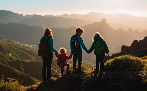  Family on a hill looking into sunset